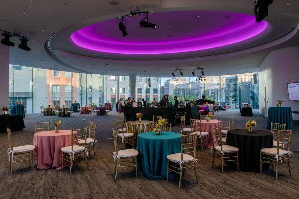 Large venue space with windows and hollow neon ceiling