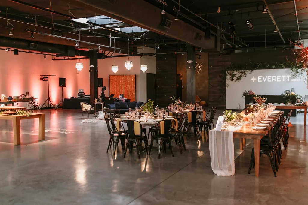 Venue with long tables and small chandeliers
