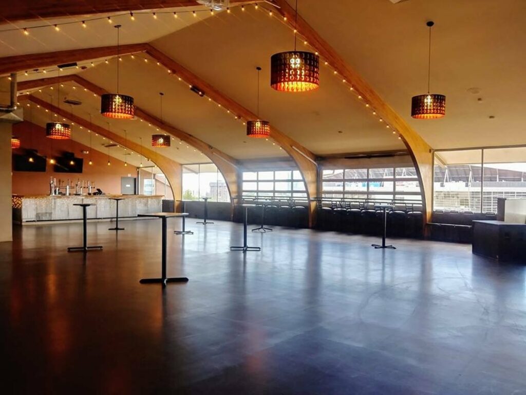 Field House Denver event venue with pointed ceilings and string lighting 