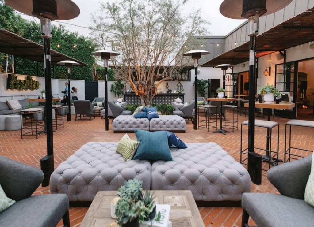 Gracias Madre LA outdoor venue space with heating lamps and lounge chairs 