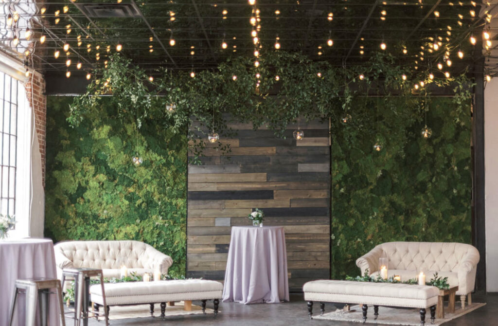 Moss Denver venue with rustic wood and moss wall