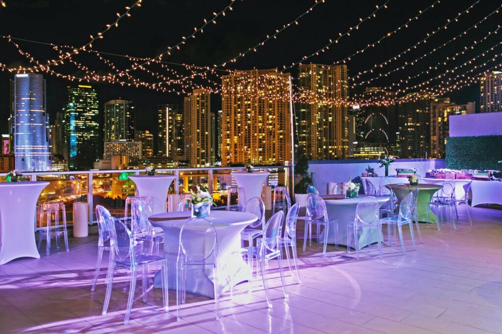 Penthouse at Riverside Wharf in Miami at night decorated with string lights.