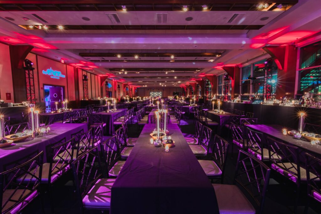 Pier sixty venue with pink and purple neon lighting 