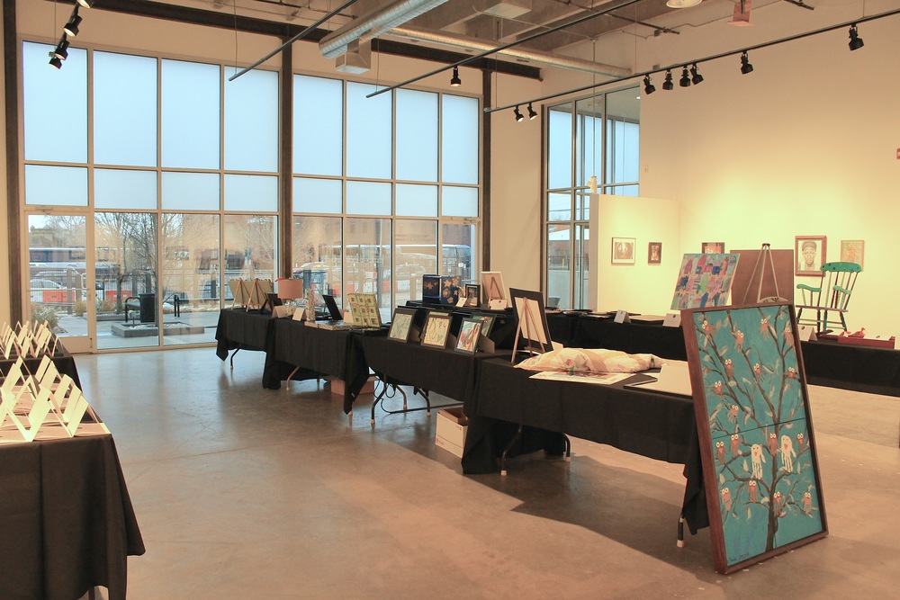 Event space with large windows and art displayed