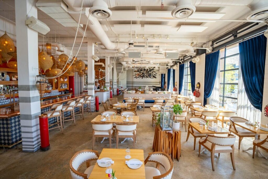 Seapsice restaurant in Miami with bright light and navy and white decor