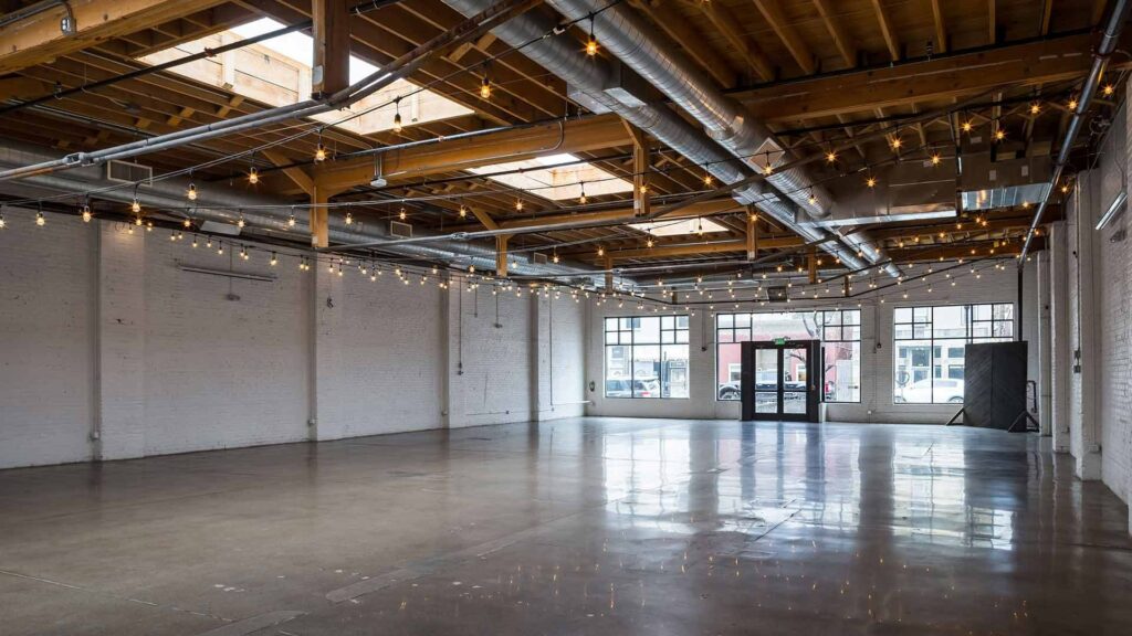 Skylight Denver indoor venue open space with ceiling string lights