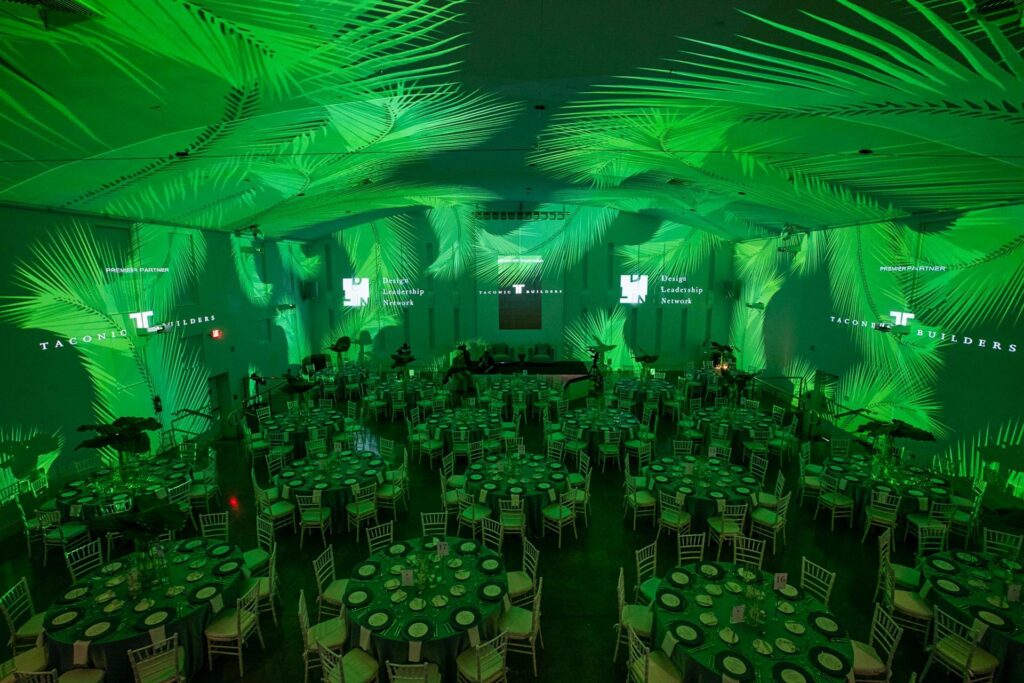 The Temple House in Miami set up for a large event with green uplighting.