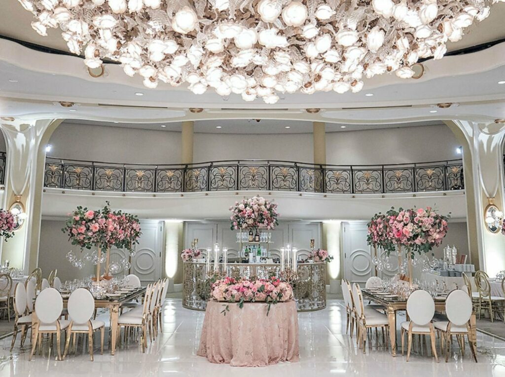 The Beverly Hills Hotel LA ballroom with floral arrangements