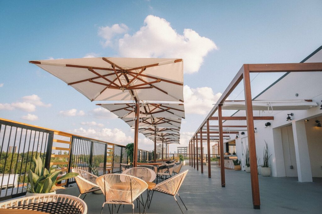 The Citadel Miami rooftop with large white umbrellas