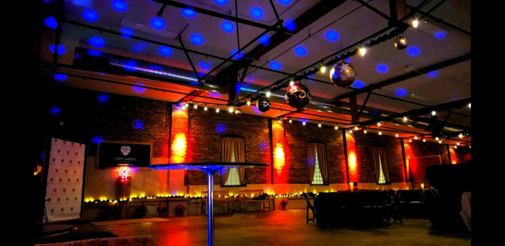 Upper Larimer venue with blue and red lights 