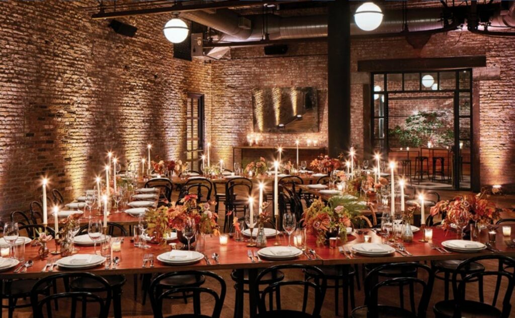 Wythe Hotel Dining roomo with brick walls and candelight