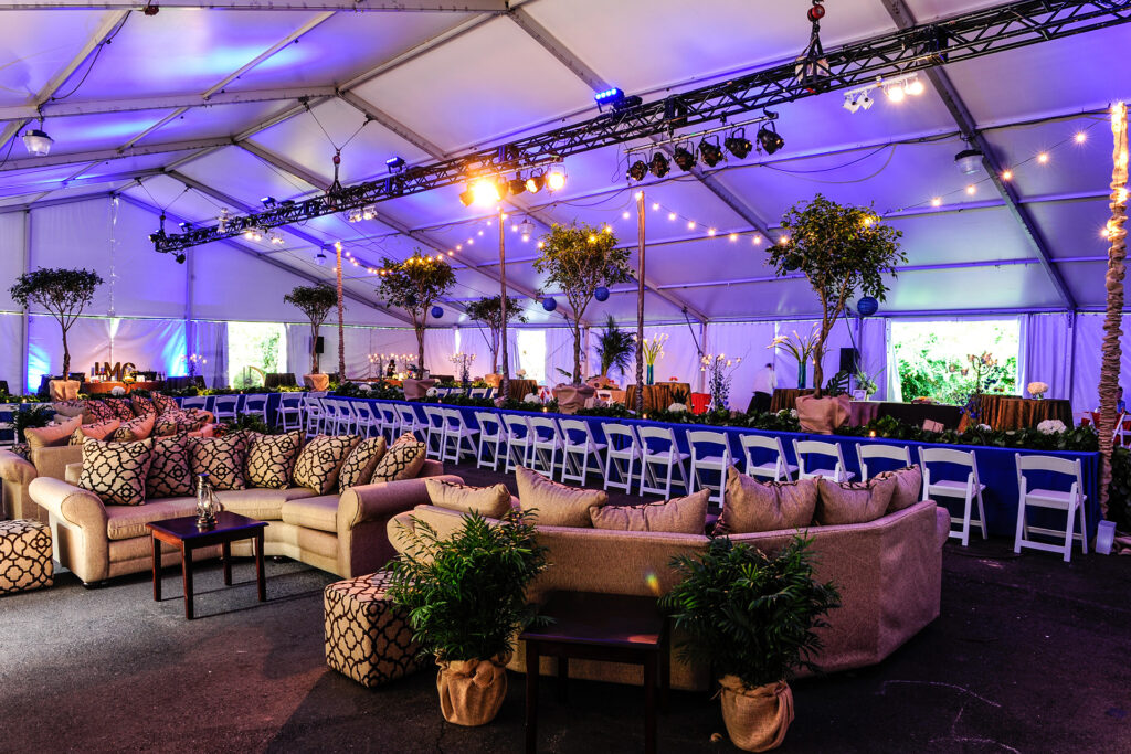Zoo Atlanta indoor venue with string lights and purple lighting and couches 