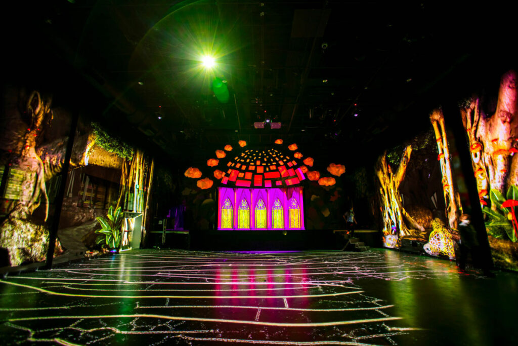 Venue with black floors and neon walls 