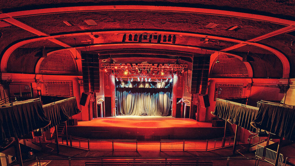 The Ogden Theatre with red lights and stage