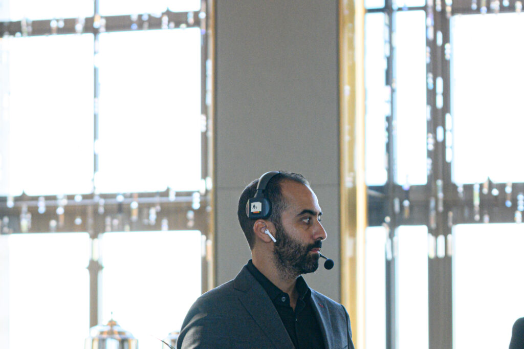Liron David at an event wearing a headset