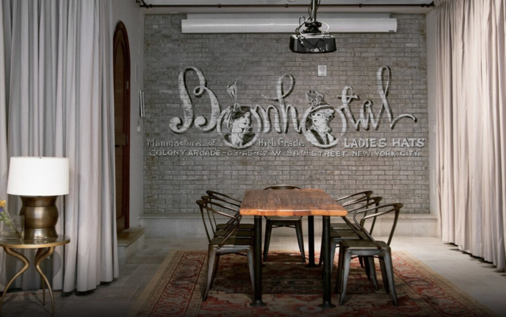 Industrial looking room with a wodden table and iron chairs