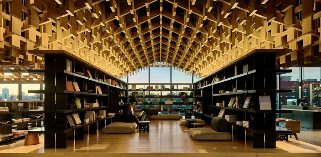 Venue space with vaulted ceillings and large bookcases 