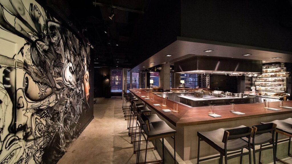 NYC Acclaimed Restaurant Momofuko Ko's main dining room with hibachi style seating