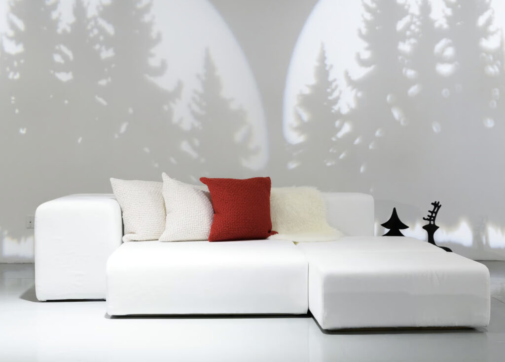 Center 415 Winter Wonderland with white couch and tree gobo lighting