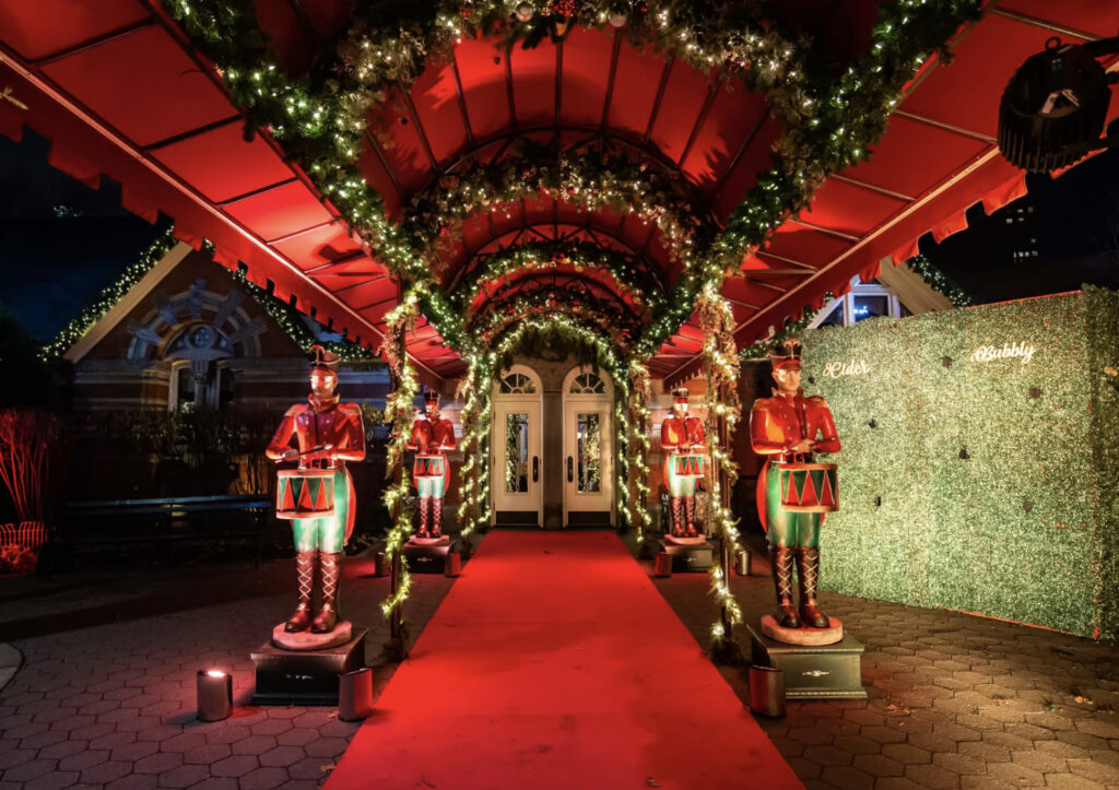 Entrance to Tavern on the Green decorated in red and green for Christmas