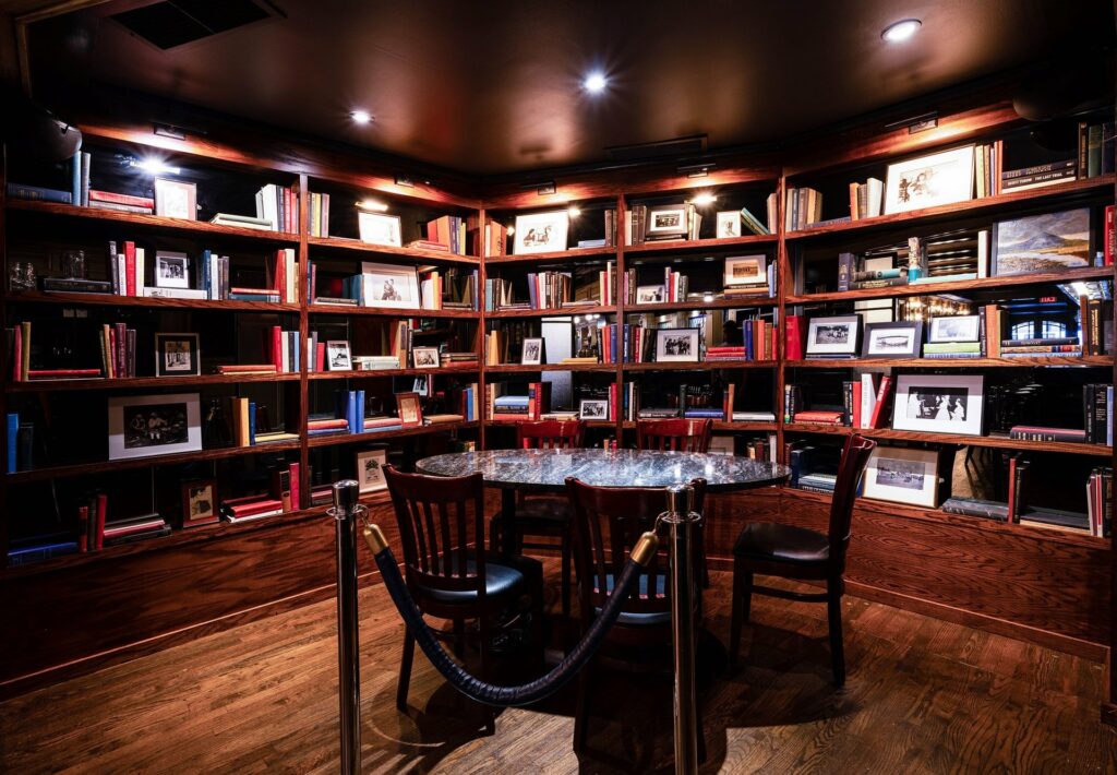 Maggies Place in NYC's private dining space called The Nook surrounded by walls of books