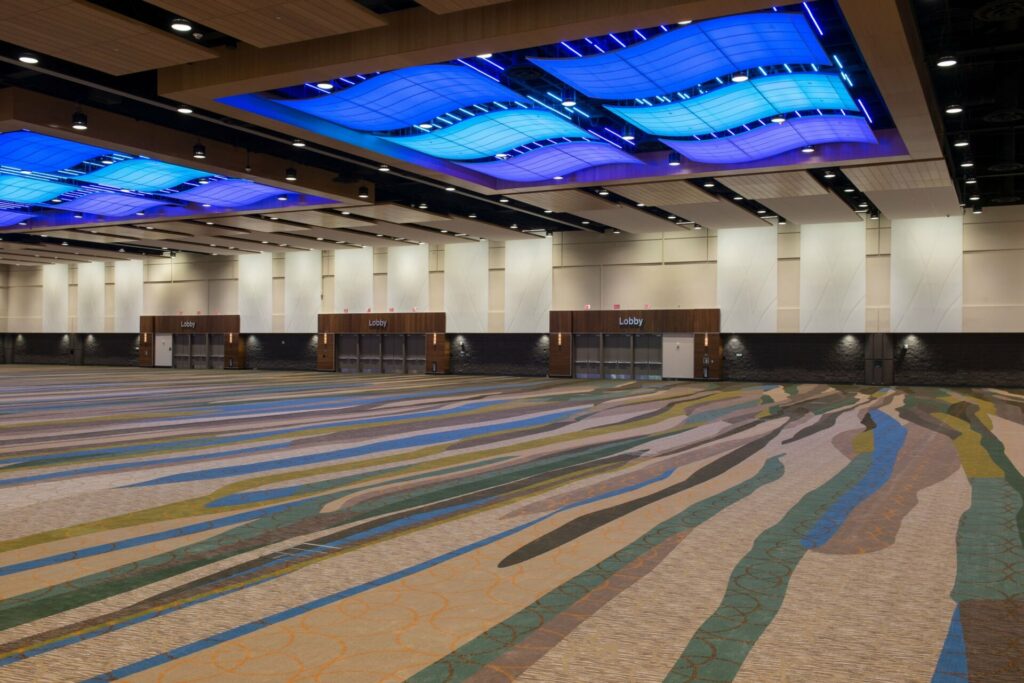 Orange County Convention Center with multicolor carpet and blue and purple overhead lights