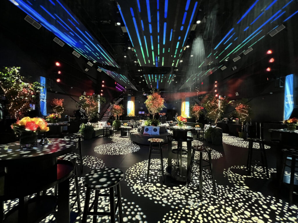 Nebula nightclub in NYC with neon lights on the ceiling and gobo lights on the floor