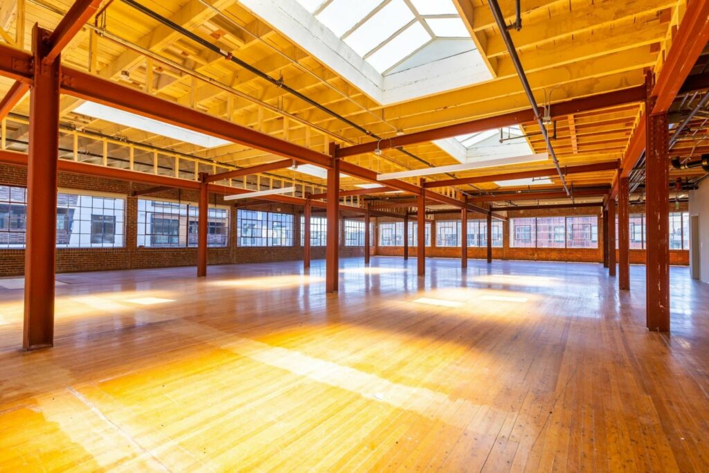 large venue of Storek in San Francisco with wooden floors and metal beams