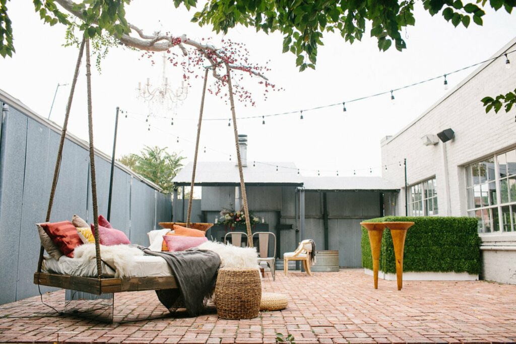 blanc in Denver with an open patio and large couch swing