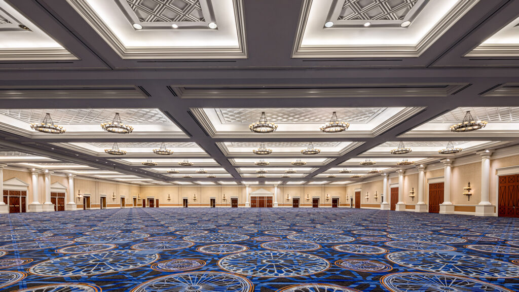 A huge empty ballroom with high ceiling and plenty of lighting