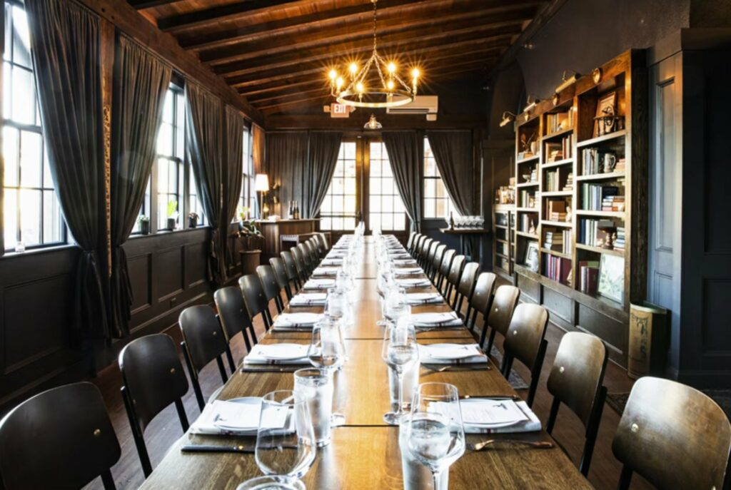 A library private dining room with large windows giving natural lighting to the room