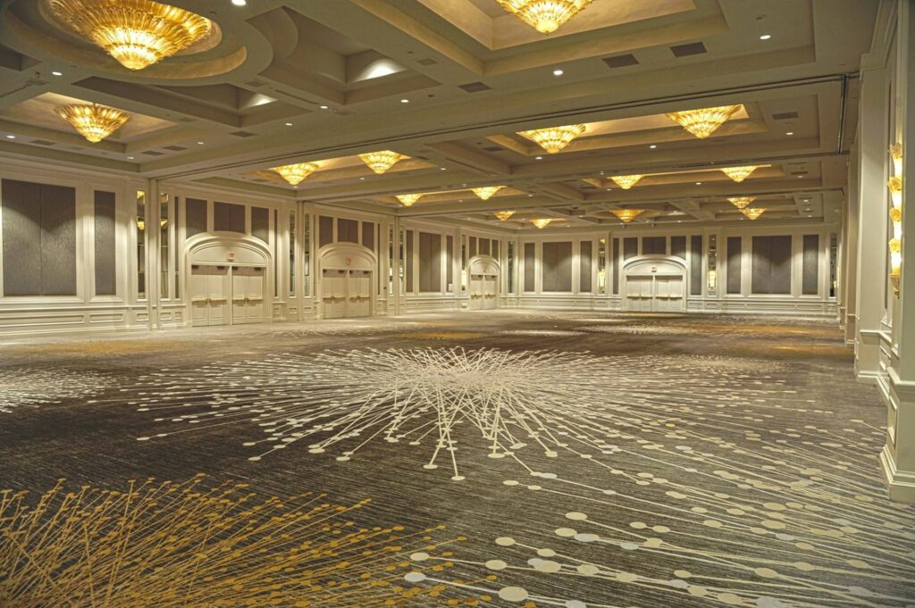 An empty ballroom with plenty of lighting
