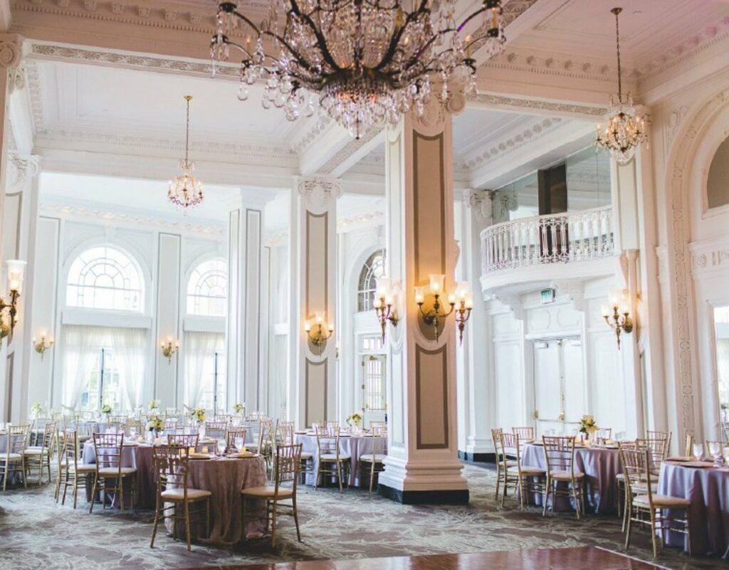 A spacious event space with a high ceiling, plenty of lighting, and elegant design 