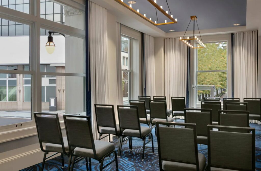 A modern-looking event space with a floor to ceiling windows 