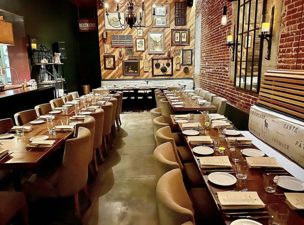 A private dining room with some vintage decor, and an exposed brick wall design