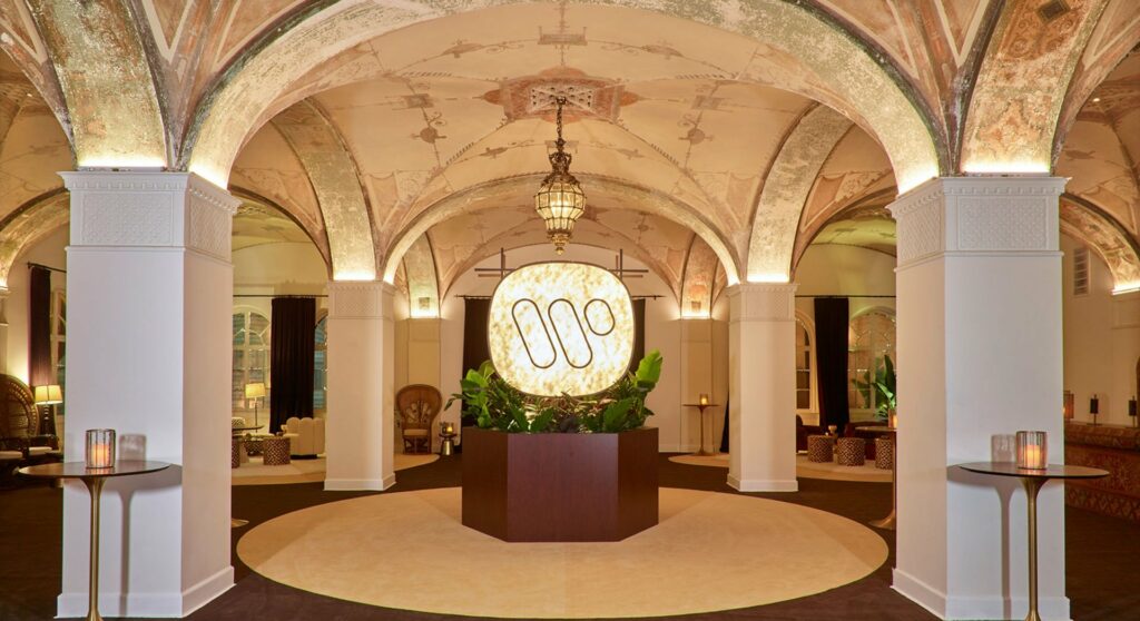 Hollywood Athletic Club lobby with a large light fixture centerpiece